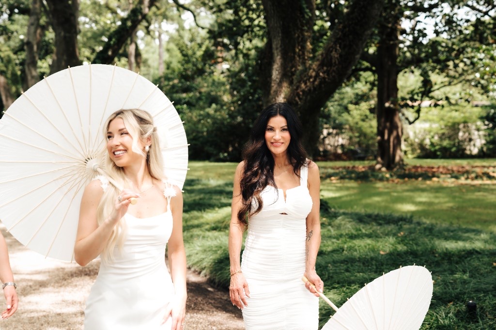 Kirsten Behler and Gina at The Beauty Society with white parasols
